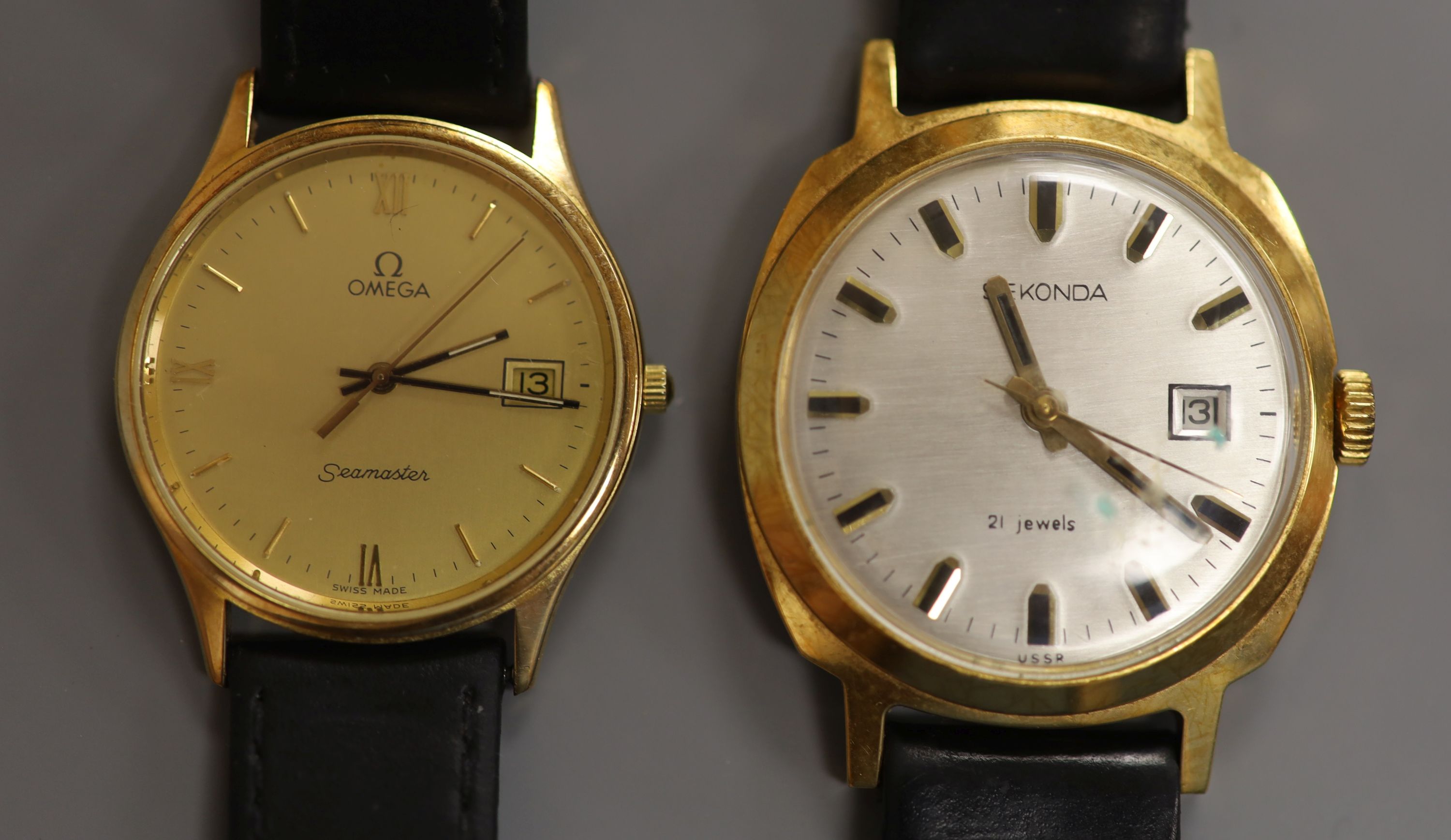 A gentleman's Omega Seamaster 9ct gold quartz watch, on a leather strap, gross 27.6 grams and a Sekonda watch.